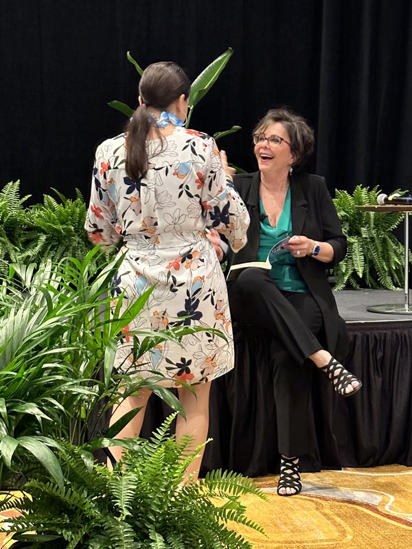 Marlene talking to a guest