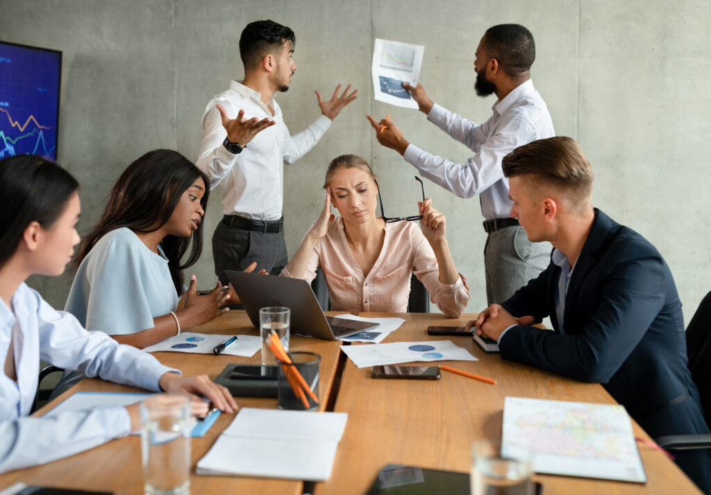 a business meeting with conflict around a table